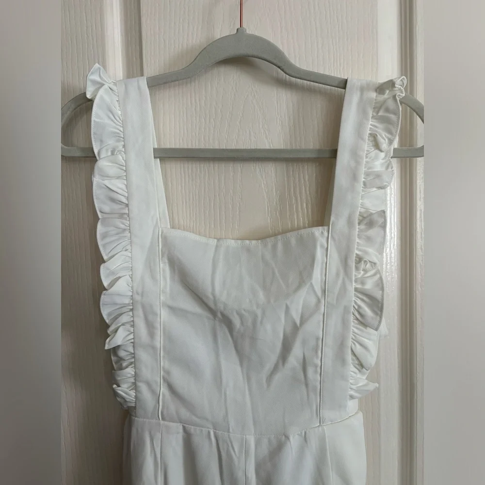 New without tags off-white jumpsuit. Size medium.‎